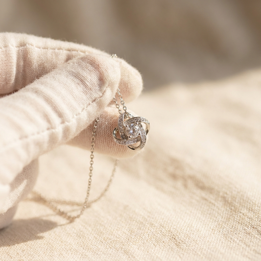 Close macro view of a projection pendant held between fingertips