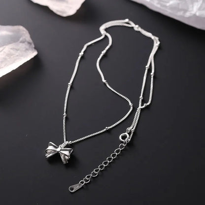 Charming Ribbon Bow Pendant Necklace - Hidden Forever