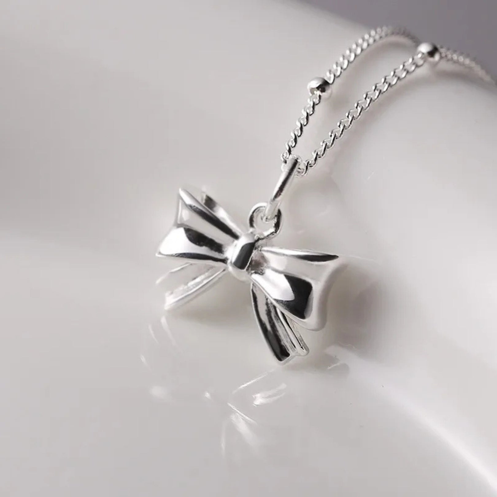 Charming Ribbon Bow Pendant Necklace - Hidden Forever