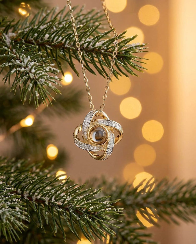 A projection pendant hanging on a Christmas tree branch