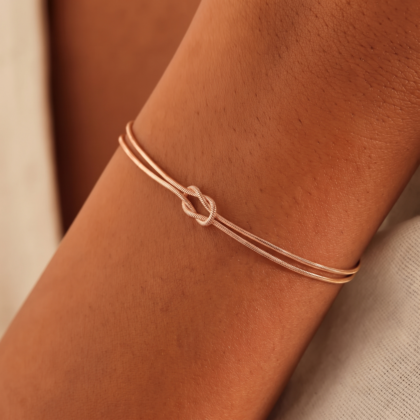 Grandmother & Granddaughter Eternal Bond Knot Bracelets in rose gold worn on the wrist