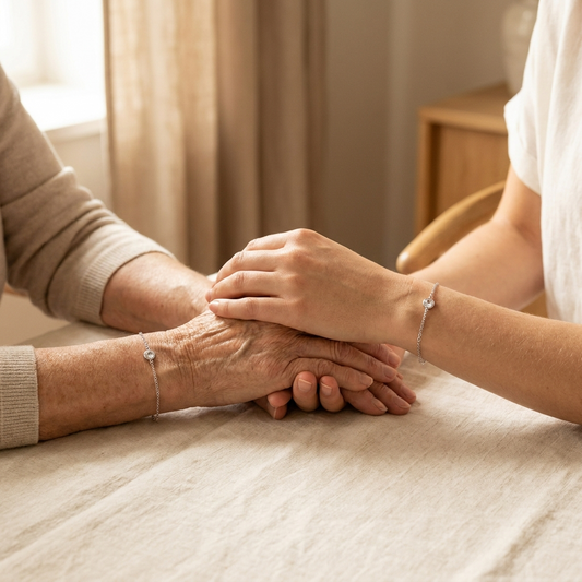Mother and daughter wearing matching photo projection bracelets, hands resting together